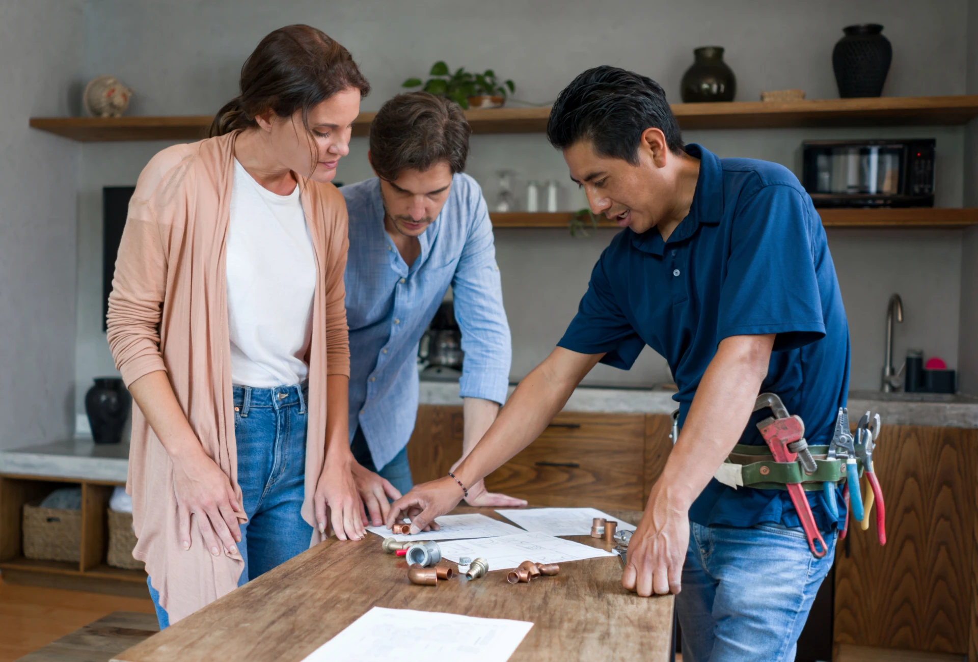 Couple discussing plans with handyman