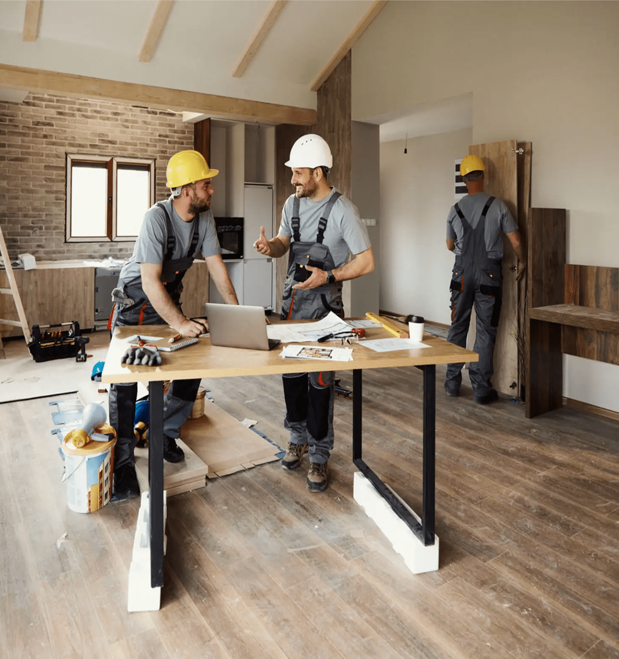 Construction workers discussing renovation plans
